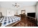 Spacious main bedroom with a vaulted ceiling, hardwood floors, and an en-suite bathroom at 184 Chamberlyn Ln, Hiram, GA 30141