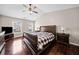 Inviting main bedroom with a vaulted ceiling, hardwood floors, and large windows at 184 Chamberlyn Ln, Hiram, GA 30141