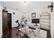 Home office setup with a large desk, workout bike, and hardwood floors at 184 Chamberlyn Ln, Hiram, GA 30141