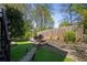 Picturesque backyard with stone accents and lush landscaping for privacy and beauty at 2241 Harry Brooks Nw Dr, Atlanta, GA 30318