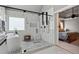 Modern bathroom featuring a soaking tub, walk-in shower, and access to the Primary bedroom at 2241 Harry Brooks Nw Dr, Atlanta, GA 30318