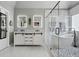 Spa-like bath boasts double vanities, glass shower, freestanding tub, and designer finishes at 2241 Harry Brooks Nw Dr, Atlanta, GA 30318