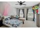 Bright bedroom showcasing two twin beds, plenty of natural light, and neutral decor at 2241 Harry Brooks Nw Dr, Atlanta, GA 30318