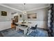 Formal dining room with modern lighting fixture, large dining table, and picture window at 2241 Harry Brooks Nw Dr, Atlanta, GA 30318