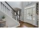 Bright foyer with hardwood floors and staircase, creating an open and inviting entrance to the home at 2241 Harry Brooks Nw Dr, Atlanta, GA 30318
