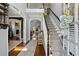 Inviting foyer with hardwood floors, staircase, and views into the living room, offering a warm welcome at 2241 Harry Brooks Nw Dr, Atlanta, GA 30318