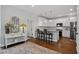 Stylish kitchen with white cabinets, granite countertops, stainless steel appliances, and modern lighting at 2241 Harry Brooks Nw Dr, Atlanta, GA 30318
