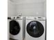 Well-equipped laundry room with modern washer and dryer appliances at 2241 Harry Brooks Nw Dr, Atlanta, GA 30318