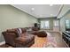 Comfortable living room featuring plush seating, a large window, and stylish decor at 2241 Harry Brooks Nw Dr, Atlanta, GA 30318