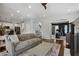 Open-concept living room flowing into the kitchen and office, featuring hardwood floors and modern decor at 2241 Harry Brooks Nw Dr, Atlanta, GA 30318