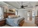 Spacious main bedroom with tray ceilings, ceiling fan, carpet floors, and natural light at 2241 Harry Brooks Nw Dr, Atlanta, GA 30318