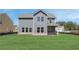 Large backyard with spacious lawn and a view of the home's exterior at 255 Arnewood Cir, Mcdonough, GA 30253
