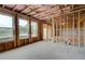Unfinished basement framed with windows offers natural light and customization options at 255 Arnewood Cir, Mcdonough, GA 30253