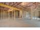 Unfinished basement with exposed wood framing and insulation offers potential for customization at 255 Arnewood Cir, Mcdonough, GA 30253