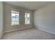 Neutral bedroom featuring soft carpet, bright windows and a clean, calming aesthetic at 255 Arnewood Cir, Mcdonough, GA 30253