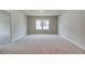 Bedroom featuring neutral carpet and a window at 255 Arnewood Cir, Mcdonough, GA 30253