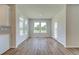 Dining room features a bright, open layout with luxury vinyl plank flooring and a door to the backyard at 255 Arnewood Cir, Mcdonough, GA 30253