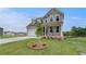 Well-kept two-story home featuring a garage and covered porch surrounded by a lush green lawn at 255 Arnewood Cir, Mcdonough, GA 30253