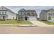 Charming two-story home featuring a manicured lawn, a two-car garage and a welcoming entryway at 255 Arnewood Cir, Mcdonough, GA 30253