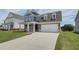 Charming two-story home with a manicured lawn, tasteful landscaping and a two-car garage at 255 Arnewood Cir, Mcdonough, GA 30253