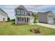 Charming two-story home featuring manicured lawn, tasteful landscaping and a two-car garage at 255 Arnewood Cir, Mcdonough, GA 30253