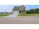 Charming two-story home with a well-manicured lawn, attached garage, and inviting front porch at 255 Arnewood Cir, Mcdonough, GA 30253