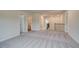 Upstairs hallway with gray carpet and white doors leading to various rooms, including a laundry room at 255 Arnewood Cir, Mcdonough, GA 30253