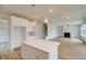 Modern kitchen with a center island open to the living area, perfect for entertaining guests and Gathering at 255 Arnewood Cir, Mcdonough, GA 30253