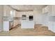 Well-lit kitchen boasts white cabinetry, stainless steel appliances, subway tile backsplash, and a center island at 255 Arnewood Cir, Mcdonough, GA 30253