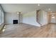 Inviting living room featuring hardwood floors, fireplace, and open access to other areas at 255 Arnewood Cir, Mcdonough, GA 30253