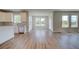 Spacious living room featuring hardwood floors, natural light and an open floor plan at 255 Arnewood Cir, Mcdonough, GA 30253