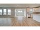 Open-concept area with a blend of kitchen and living spaces, showcasing modern design and ample light at 255 Arnewood Cir, Mcdonough, GA 30253