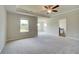 Large main bedroom has plush carpet, a tray ceiling, and access to the en-suite bath at 255 Arnewood Cir, Mcdonough, GA 30253