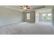 Spacious main bedroom features plush carpet, tray ceiling and an abundance of natural light at 255 Arnewood Cir, Mcdonough, GA 30253