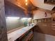 Well-lit attic workshop with workbench, pegboard, and storage for projects at 262 Bomar Ln, Douglasville, GA 30134