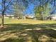 A large, grassy backyard, perfect for outdoor activities, backs up to neighboring homes at 262 Bomar Ln, Douglasville, GA 30134