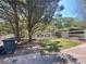 Backyard with white fence and mature trees, offering privacy and a serene outdoor space at 262 Bomar Ln, Douglasville, GA 30134
