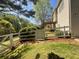 Spacious fenced backyard with a deck and lush landscaping, perfect for outdoor enjoyment and privacy at 262 Bomar Ln, Douglasville, GA 30134
