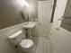 Cozy bathroom features a pedestal sink, decorative lighting, and classic white wainscoting at 262 Bomar Ln, Douglasville, GA 30134
