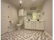 Bright bathroom featuring a double sink vanity with white cabinets and hexagon-patterned tile flooring at 262 Bomar Ln, Douglasville, GA 30134