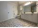 Bathroom with double sink vanity, patterned tile floor, and plenty of storage space at 262 Bomar Ln, Douglasville, GA 30134