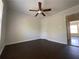 The bedroom features a ceiling fan, and a glimpse into another room at 262 Bomar Ln, Douglasville, GA 30134