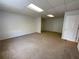A bonus room featuring wall-to-wall carpeting and a door on the right at 262 Bomar Ln, Douglasville, GA 30134