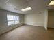 A bonus room featuring wall-to-wall carpeting and a window at 262 Bomar Ln, Douglasville, GA 30134
