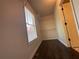 Cozy closet featuring dark wood floors, a window, and ample storage space with built-in shelving at 262 Bomar Ln, Douglasville, GA 30134