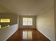 Dining room with hardwood floors, modern lighting, and large window at 262 Bomar Ln, Douglasville, GA 30134