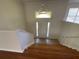 Bright foyer with hardwood stairs and tile floor provides a welcoming first impression at 262 Bomar Ln, Douglasville, GA 30134
