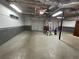 Spacious garage with dual doors, shelving, and ample room for parking and storage at 262 Bomar Ln, Douglasville, GA 30134
