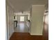 Bright, open kitchen leading to the next room with stainless steel appliances and white cabinets at 262 Bomar Ln, Douglasville, GA 30134