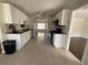 Spacious kitchen featuring white cabinets, black countertops and stainless steel appliances at 262 Bomar Ln, Douglasville, GA 30134